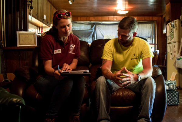 asp staffer filling out paper work with adult male homeowner